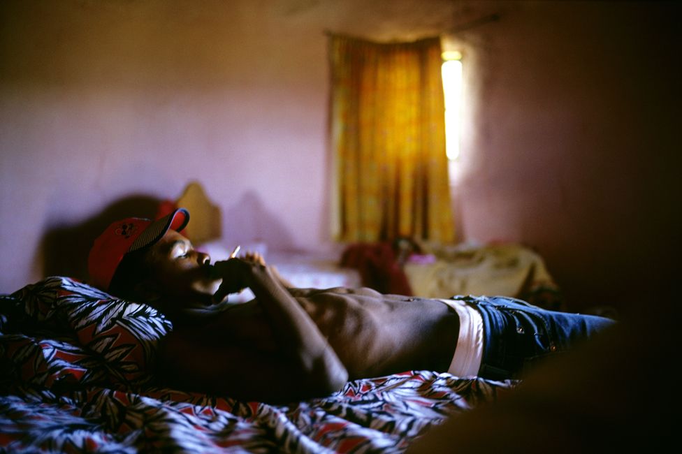 A boy rests in a hut in Lady Frere, in 2000, before starting a traditional Xhosa manhood ceremony